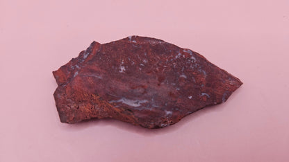Moss Agate slab 22g, reddish with blue-white moss-like inclusions, 2.6x1.3 inches, photographed on pink background.