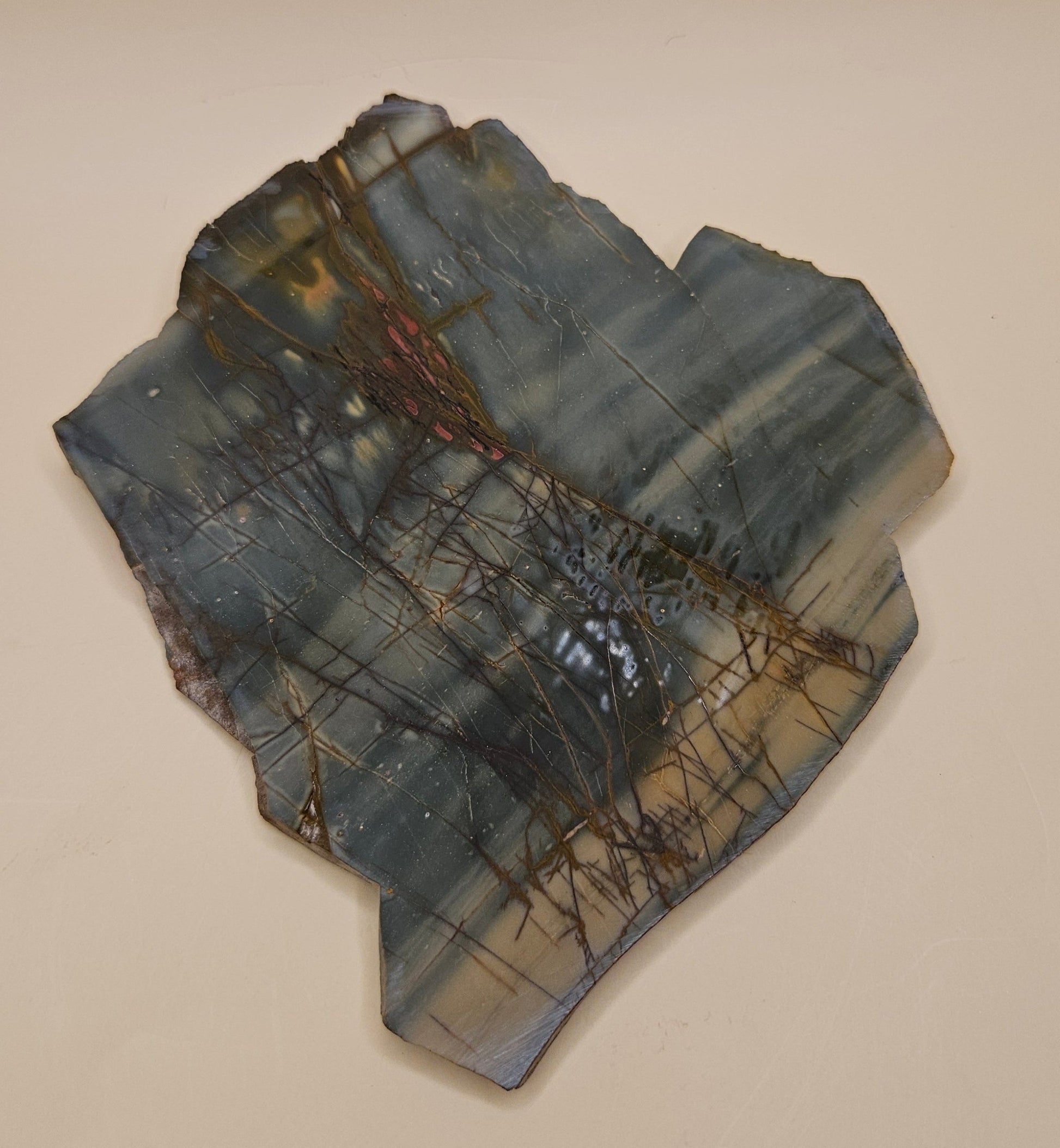 Cherry Creek Jasper slab, polished, showing soft green, beige, and pink tones with natural veining, 180 grams.