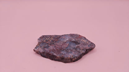 18g Moss Agate slab featuring lavender, gold, and reddish inclusions with rough edges, 2.1x1.4 inches, shown in hand.