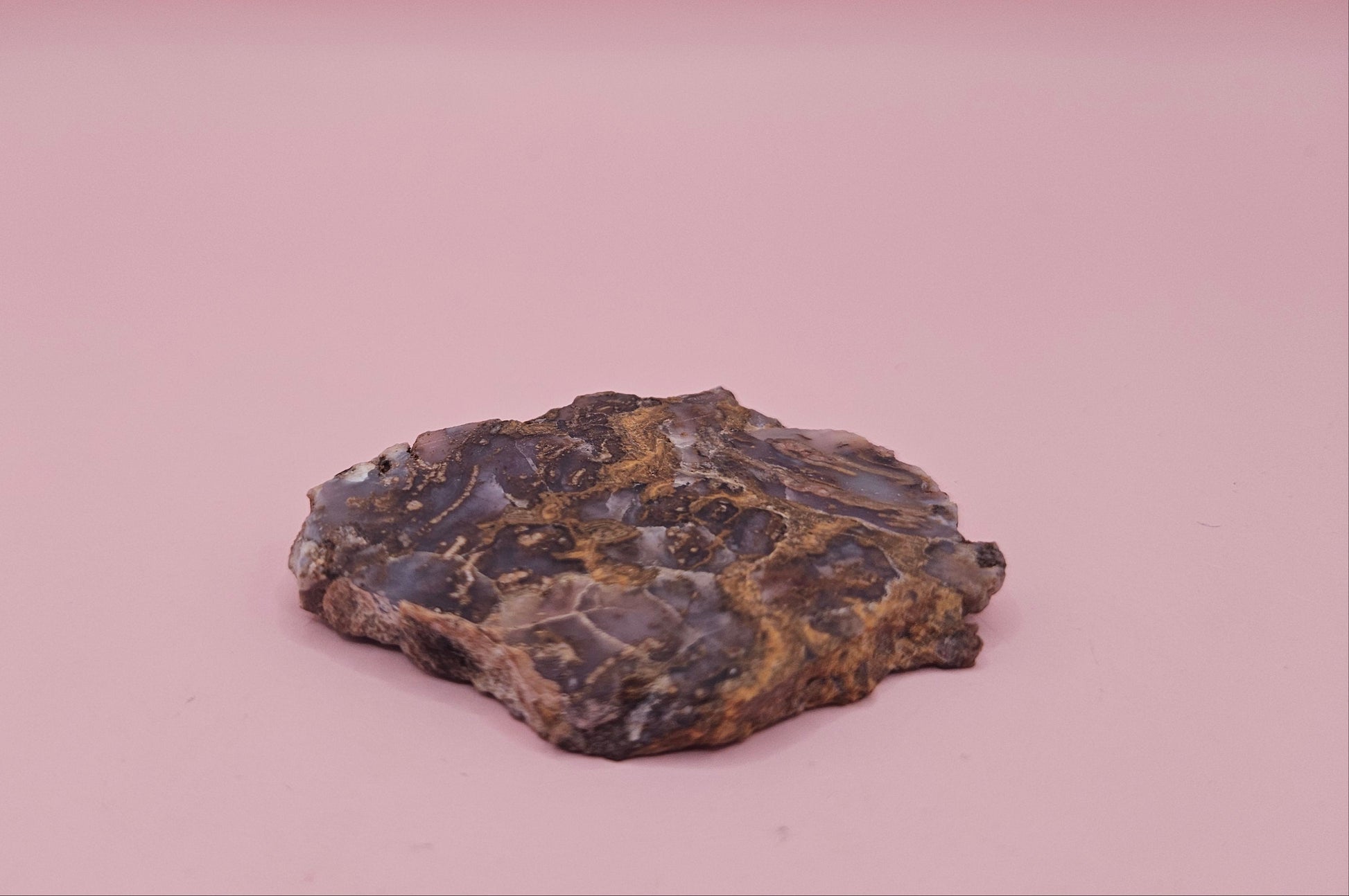 23g Moss Agate slab with smoky lavender tones and golden mossy veins, 2.1x1.7 inch specimen held in hand.