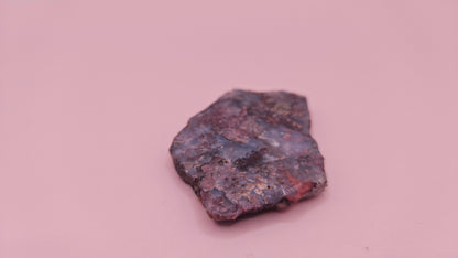 18g Moss Agate slab featuring lavender, gold, and reddish inclusions with rough edges, 2.1x1.4 inches, shown in hand.